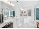 Bright bathroom featuring dual sinks, vanity and glass enclosed shower at 1302 Turtlebrook Ln, Lawrenceville, GA 30043