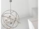 Modern chrome chandelier with droplet accents against a high white ceiling at 1302 Turtlebrook Ln, Lawrenceville, GA 30043