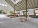 Spacious clubhouse interior with stone seating, open views, and beverage center, perfect for community gatherings at 1302 Turtlebrook Ln, Lawrenceville, GA 30043