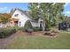 Community clubhouse featuring picnic tables, grill, and well-manicured landscaping provides a charming gathering space at 1302 Turtlebrook Ln, Lawrenceville, GA 30043