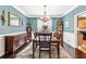 Formal dining room with classic decor, chandelier, and ample space for entertaining guests at 1302 Turtlebrook Ln, Lawrenceville, GA 30043