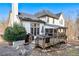 Home exterior with a deck, patio, and well-maintained yard, creating a welcoming outdoor space at 1302 Turtlebrook Ln, Lawrenceville, GA 30043