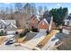 Traditional brick home with a well-manicured front yard, a long driveway and attached two car garage at 1302 Turtlebrook Ln, Lawrenceville, GA 30043