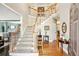 Grand foyer with hardwood floors, staircase, and elegant decor, creating a welcoming atmosphere at 1302 Turtlebrook Ln, Lawrenceville, GA 30043