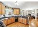 Well-appointed kitchen featuring granite countertops, hardwood floors, and seamless flow to living spaces at 1302 Turtlebrook Ln, Lawrenceville, GA 30043