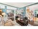 Inviting living room featuring hardwood floors, elegant decor, and plenty of natural light at 1302 Turtlebrook Ln, Lawrenceville, GA 30043
