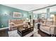 Cozy living room featuring hardwood floors, elegant decor, and ample natural light at 1302 Turtlebrook Ln, Lawrenceville, GA 30043
