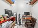 Functional home office space with shelves, desk, and comfortable chair, ready for work or study at 1302 Turtlebrook Ln, Lawrenceville, GA 30043