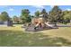Fun community playground with slides and play equipment set in a grassy area for outdoor enjoyment at 1302 Turtlebrook Ln, Lawrenceville, GA 30043