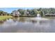 Scenic view of the tranquil pond with a fountain, showcasing waterfront community living at its finest at 1302 Turtlebrook Ln, Lawrenceville, GA 30043