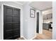 Entryway with black door and kitchen view at 2251 Pernoshal Ct, Atlanta, GA 30338