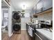 Eat-in kitchen with stainless steel appliances and in-unit laundry at 2251 Pernoshal Ct, Atlanta, GA 30338