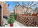 Cozy patio with brick wall, potted plants, and seating area at 2251 Pernoshal Ct, Atlanta, GA 30338