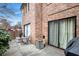 Brick patio with seating area, adjacent to building and grilling area at 2251 Pernoshal Ct, Atlanta, GA 30338