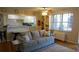 Cozy living room with adjacent kitchen and bar seating at 300 W Peachtree St # 21N, Atlanta, GA 30308