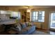 Comfortable living space with an open floor plan and access to a balcony at 300 W Peachtree St # 21N, Atlanta, GA 30308