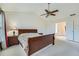 Bedroom featuring vaulted ceiling, neutral carpet, and ensuite access at 10965 Glenbarr Dr, Johns Creek, GA 30097