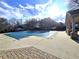 Community pool is covered in the off-season, and has a lounging area at 10965 Glenbarr Dr, Johns Creek, GA 30097