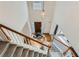 View of the home's foyer showing the front door and a staircase with carpet at 10965 Glenbarr Dr, Johns Creek, GA 30097