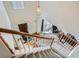 View from the top of the stairs showing the home's foyer and front door at 10965 Glenbarr Dr, Johns Creek, GA 30097