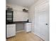 Well-organized laundry area featuring countertops, storage cabinets, and tile flooring at 296 Cedar Bay Cir, Dallas, GA 30157