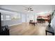 Spacious living room open to the kitchen and dining area with sleek flooring and modern design at 296 Cedar Bay Cir, Dallas, GA 30157