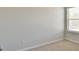 Neutral carpeted bedroom featuring a window for natural light at 7889 Winkman Dr, Fairburn, GA 30213