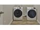 Laundry room with white front load washer and dryer at 7889 Winkman Dr, Fairburn, GA 30213