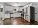 Modern kitchen with white cabinets, stainless steel appliances, and hardwood floors at 1893 Windsor Sw Dr, Atlanta, GA 30311