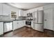 Modern kitchen with white cabinets, stainless steel appliances, and beautiful countertops at 1893 Windsor Sw Dr, Atlanta, GA 30311