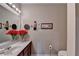 Bathroom features a single sink vanity, a mirror, and decorative lighting at 1965 Nocturne Dr # 1205A, Alpharetta, GA 30009