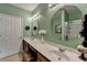 Bright bathroom with a double sink vanity, framed mirrors, and stylish lighting fixtures at 1965 Nocturne Dr # 1205A, Alpharetta, GA 30009