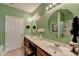 Bathroom featuring dual sinks, a large mirror, and bright lighting at 1965 Nocturne Dr # 1205A, Alpharetta, GA 30009