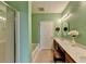 Bathroom featuring dual sinks, a tub, and a glass shower at 1965 Nocturne Dr # 1205A, Alpharetta, GA 30009