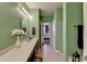 Bright bathroom with a double sink vanity, framed mirrors, and stylish lighting fixtures at 1965 Nocturne Dr # 1205A, Alpharetta, GA 30009