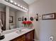 Bathroom features a single sink vanity and decorative accents and lighting at 1965 Nocturne Dr # 1205A, Alpharetta, GA 30009