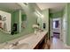 Bright bathroom with a double sink vanity, framed mirrors, and stylish lighting fixtures at 1965 Nocturne Dr # 1205A, Alpharetta, GA 30009