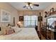 Bedroom features a four-poster bed, ceiling fan, and dresser at 1965 Nocturne Dr # 1205A, Alpharetta, GA 30009