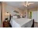 Bedroom with a bed, ceiling fan and a side table at 1965 Nocturne Dr # 1205A, Alpharetta, GA 30009