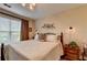 Comfortable bedroom with a bed, ceiling fan and a side table at 1965 Nocturne Dr # 1205A, Alpharetta, GA 30009