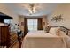 Bedroom with a ceiling fan, dresser and a window providing natural light at 1965 Nocturne Dr # 1205A, Alpharetta, GA 30009