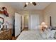 Bedroom features a four-poster bed, and multiple closet and door access points at 1965 Nocturne Dr # 1205A, Alpharetta, GA 30009