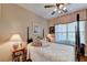 Cozy bedroom featuring a bed, side tables, and a window at 1965 Nocturne Dr # 1205A, Alpharetta, GA 30009
