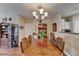 Dining room features wood table, chandelier, and decorative display shelves at 1965 Nocturne Dr # 1205A, Alpharetta, GA 30009