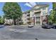 Inviting condo complex with ample parking and mature trees at 1965 Nocturne Dr # 1205A, Alpharetta, GA 30009
