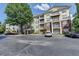 Inviting condo complex with ample parking and mature trees at 1965 Nocturne Dr # 1205A, Alpharetta, GA 30009