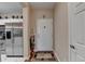 Inviting foyer with wood floors and convenient access to the kitchen at 1965 Nocturne Dr # 1205A, Alpharetta, GA 30009
