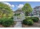 A community gazebo offers a serene spot amidst lush landscaping and manicured lawns at 1965 Nocturne Dr # 1205A, Alpharetta, GA 30009