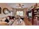 Comfortable living room with wood floors, ceiling fan, and custom built-ins at 1965 Nocturne Dr # 1205A, Alpharetta, GA 30009