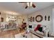 Inviting living room and dining area features neutral colors and a ceiling fan at 1965 Nocturne Dr # 1205A, Alpharetta, GA 30009
